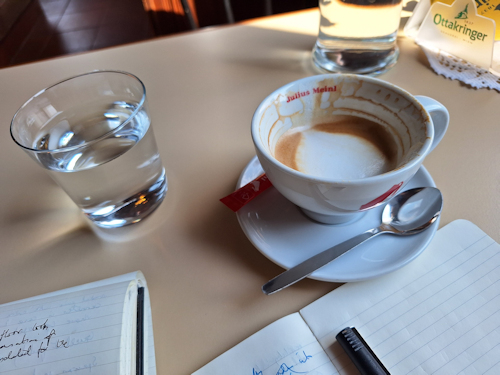 Coffee cup and notebook