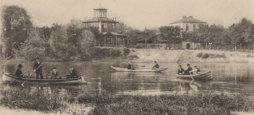 Rowing boats on a lake around 1900