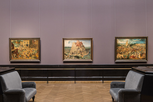View of three Bruegel paintings in a public museum room