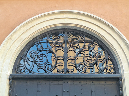 Wrought iron decoration above a church entrance