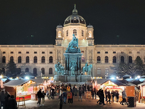 Night view of the seasonal market on Marie-Theresien-Platz