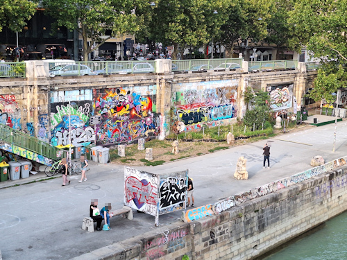 Street art alongside a river walk