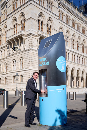 Man using a drinking fountain
