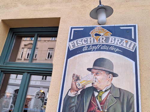 An old beer sign on the wall of a pub-restaurant