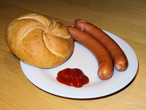 Frankfurters, roll and ketchup