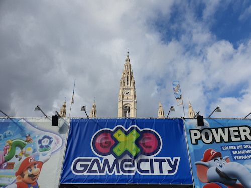 The Game City entrance with the towers of the Rathaus behind