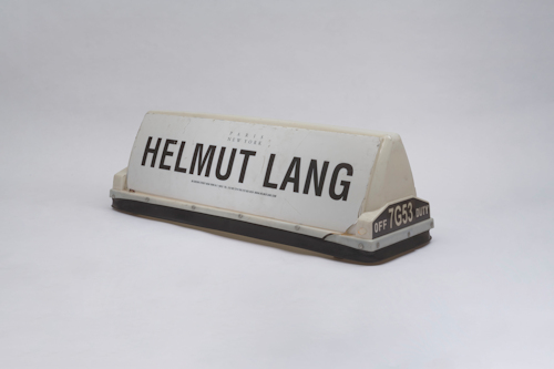 Taxi ad board with Helmut Lang written on it