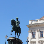 Equestrian statue with museum behind