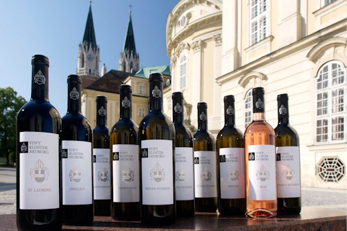 Bottles of wine in front of an abbey