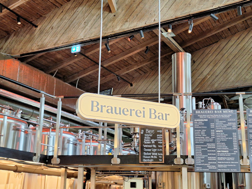Brewery bar with vats behind