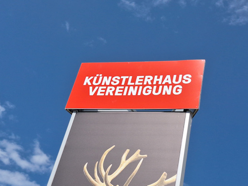 Pillar and advert for an art exhibition