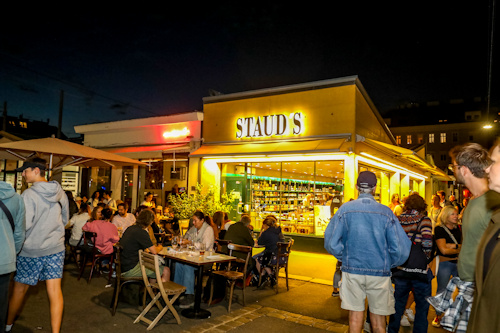 People at a market at night