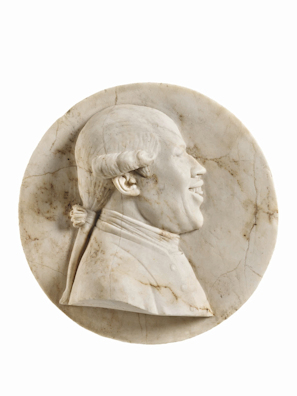 Stone relief of a smiling man