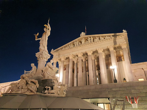 Parliament and Athena fountain at night