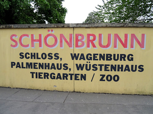 Wall sign giving directions to Schönbrunn palace