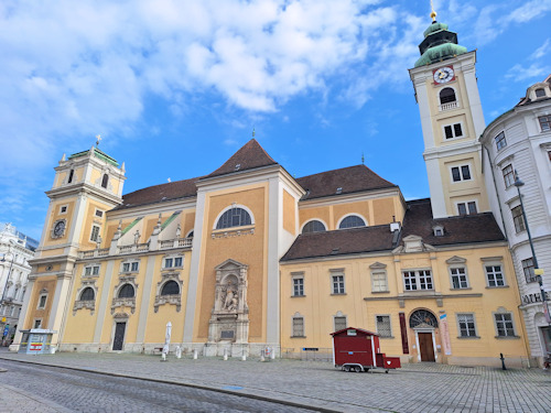 View of Schottenstiftkirche across the Freyung