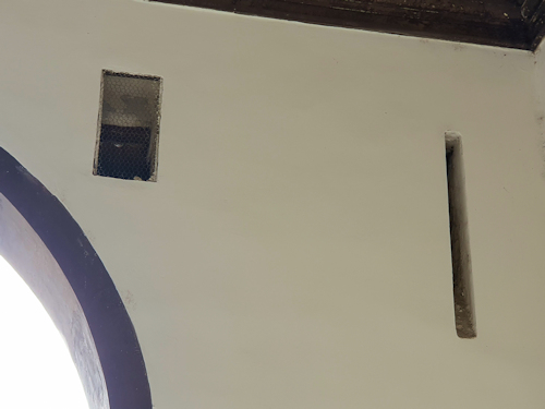 Drawbridge slots in a wall