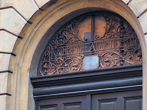 Wrought iron decoration above a 19th-century door