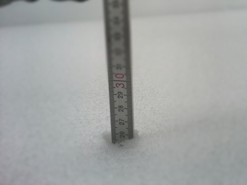 Snow with a measuring stick
