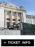 Glass roof with a historical building behind