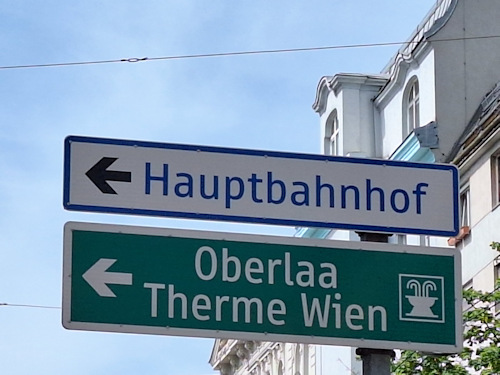 Road sign to Hauptbahnhof and Therme Wien