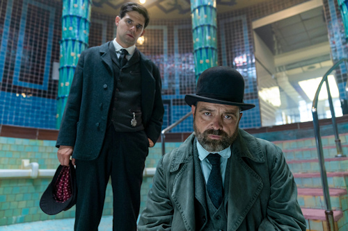 Two men in a historical empty bathing pool