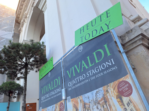 Concert posters on the side of a church