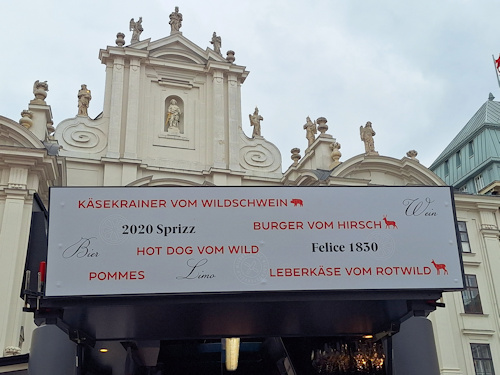 Booth sign with a church behind