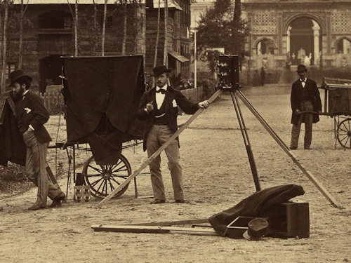 Photographers with camera and mobile dark room in 1873