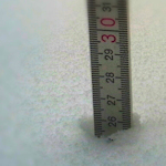 A ruler embedded in snow
